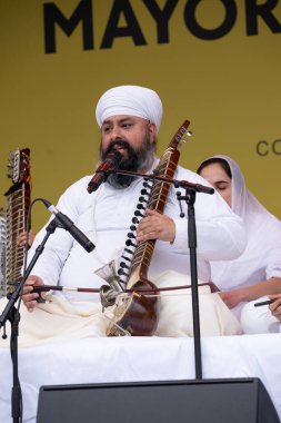 London, UK. 6th April 2024. Kirpal Singh Panesar performing on the Tar shehnai at the Vaisakhi Festival in Trafalgar Square, the event celebrating Sikh culture and the traditional spring harvest. clipart