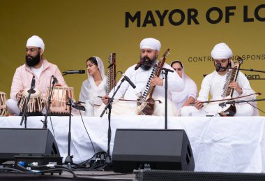 London, UK. 6th April 2024. Kirpal Singh Panesar performing on the Tar shehnai at the Vaisakhi Festival in Trafalgar Square, the event celebrating Sikh culture and the traditional spring harvest. clipart