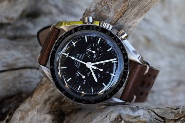 PEDASO, ITALY - OCTOBER 2020: Omega Speedmaster Professional watch. Omega has been creating watches since the 19th century and was the first watch on the Moon. Illustrative editorial. clipart