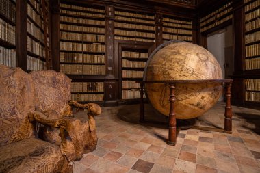 FERMO, ITALY - DECEMBER 2019: Ancient world map globe inside Palazzo dei Priori (Prior Building). clipart