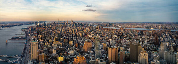 New York City Manhattan skyline panoramic aerial view with Hudson River at sunset.