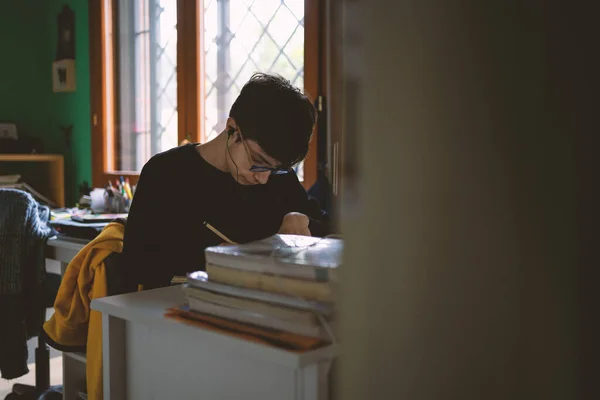 Teenager Boy Doing Homework His Room Home Writing Notes Filtered — Stock Photo, Image