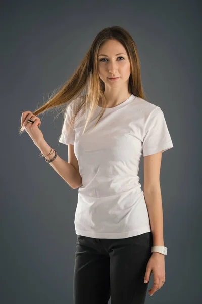 Confident Blonde Woman Wearing White Shirt Grey Background Studio Portrait — Stock Photo, Image