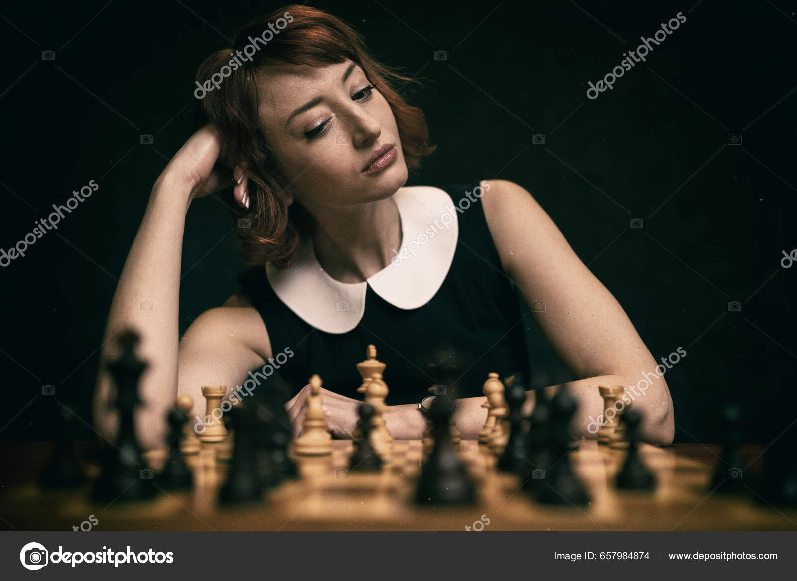 Download A Person Is Playing Chess On A Board Wallpaper