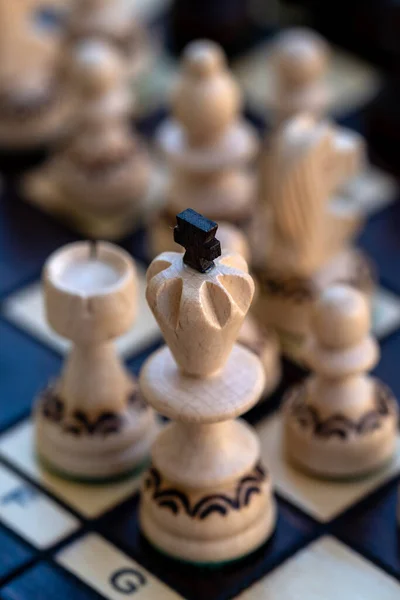 Chess game. White pieces challenging for victory. Shallow depth of field.