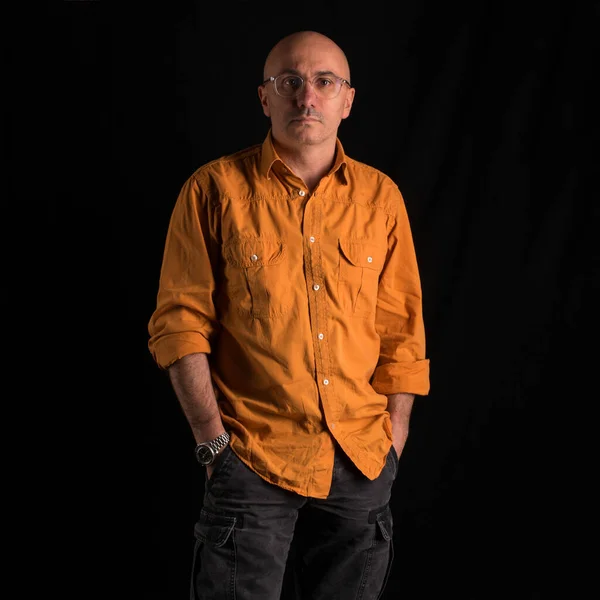 Middle Age Bald Confident Man Portrait Wearing Orange Shirt Dark — Stock Photo, Image
