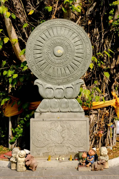 Stone boundary markers Thai style silver carving art on temple wall , Wat Srisuphan ,Chiang Mai, Thailand