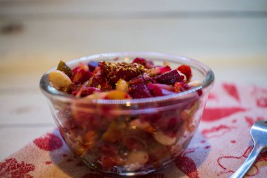 Vinaigrette in the galss bowl on the fabric napkin. 