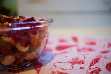 Vinaigrette in the galss bowl on the fabric napkin. 