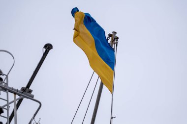 Ukrainian flag. Sky background. Flag of Ukraine flutters in blue sky. clipart