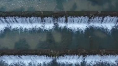 Man made beautiful large waterfall with many stairs. Aerial drone view. Horizontal video. Cascade from top view. 