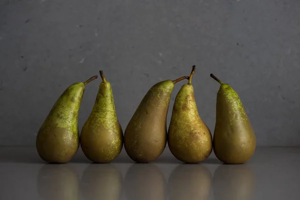 Autumn fruit still life with pears on the grey background