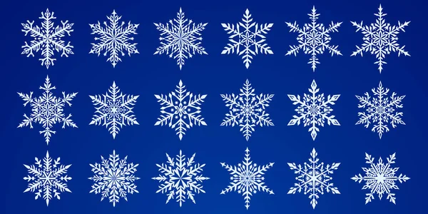 美しい複雑なクリスマスの雪の結晶のセット 青の背景に白 — ストックベクタ