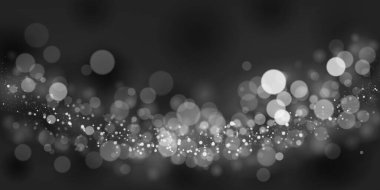 Siyah ve gri tonlarda soyut bir arkaplan, bazıları odak noktasında, bazıları ise bulanık, büyüleyici bir bokeh etkisi yaratıyor..