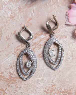 Elegant silver earrings with sparkling diamonds, showcasing their exquisite design and craftsmanship clipart