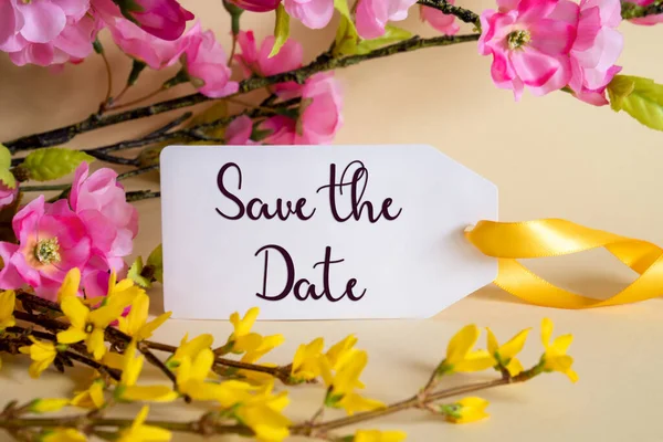 Spring Flower Arrangement With White Label With English Text Save The Date. Colorful Flower Branch Decoration With Yellow And Purple Blossoms.