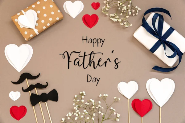 Flat Lay With English Text Happy Fathers Day. Colorful Accessories Like, Gifts, Presents, Hearts, Flowers And Male Decoration Like Mustache. Flat Lay With Paper Background.