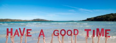 People Or Persons Hands Building English Word Have A Good Time. Summer Ocean, Sea And Beach As Background. clipart