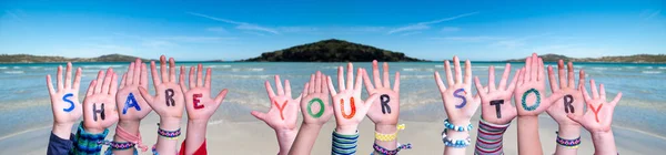 stock image Children Hands Building Colorful English Word Share Your Story. Summer Ocean, Sea And Beach As Background.