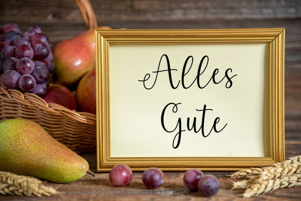 Fall Decoration with Pears, Apples and Grapes, Thanksgiving Background, Autumn Season and German Text Alles Gute, which means Best Wishes