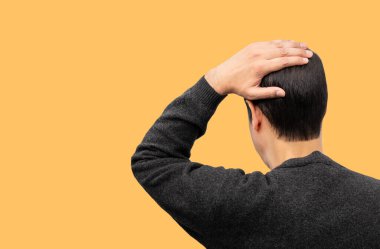 Rear view of a young man looking to the background