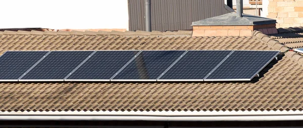 Solar panel on the roof of a house, photovoltaic, alternative electricity source and sustainable resources concept