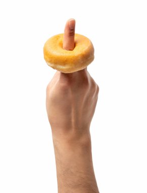 Plain donut in a man's finger isolated on a white background.