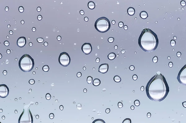 Close Drops Water Glass Surface Stockfoto