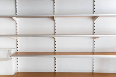 Supermarket empty shelves from front on white background