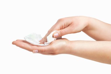 Cropped shot of an unrecognizable woman cleaning her hands with a wet baby wipe isolated on a white background