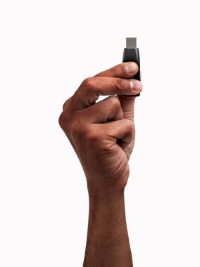 Cropped shot of an unrecognizable man hand showing a pen drive isolated on a white background