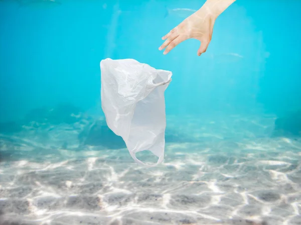 Man Hand Collecting Plastic Bag Ocean Copy Space — стоковое фото