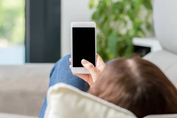 Woman Using Showing Blank Phone Screen Lying Couch Home — Stockfoto