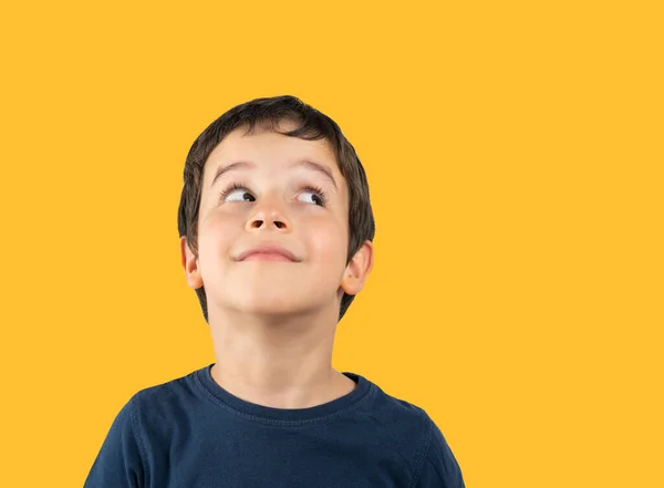 Child Blue Shirt Isolated Yellow Background Looking Away Side Smile — Stock Photo, Image