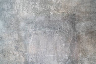 Yıpranmış gri beton zeminin yüksek açılı görüntüsü.