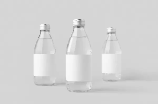 stock image Small water bottle mockup with blank label. Clear glass.