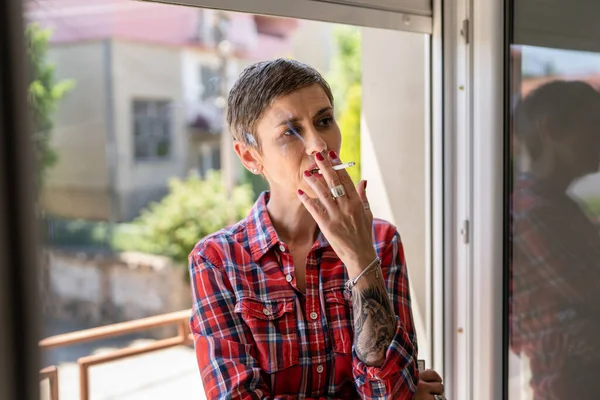 One Woman Mature Senior Female Smoking Cigarette Window Home Bright — ストック写真