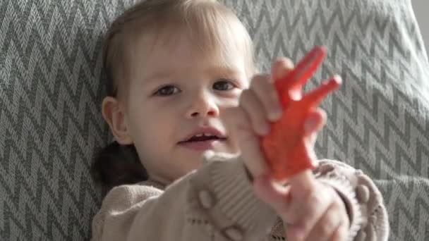 One Small Caucasian Girl Little Child Toddler Hold Plastic Finger — Stock Video