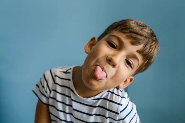 One Caucasian Boy Child Front Blue Wall Home Goofing Indoor — Stock Photo, Image