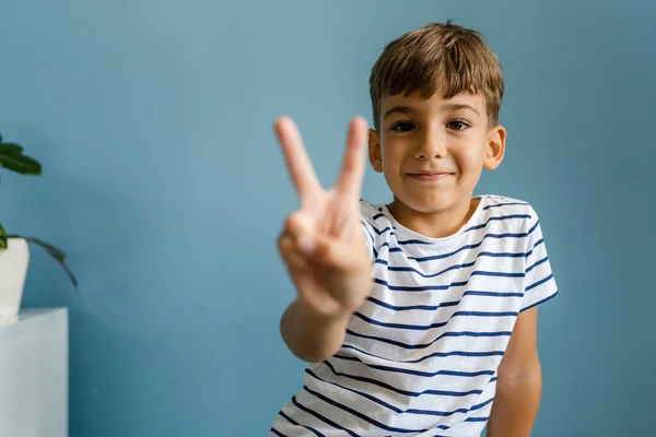 One Caucasian Boy Child Front Blue Wall Home Goofing Indoor — Stock Photo, Image
