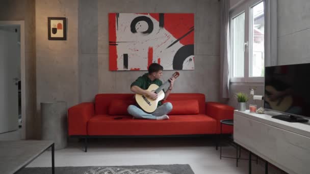 One Young Man Caucasian Teenager Sit Home Room Playing Guitar — Video