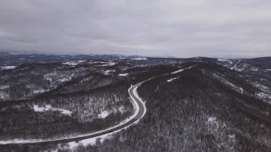 Car drive in snow winter day on the road in with snow aerial view 