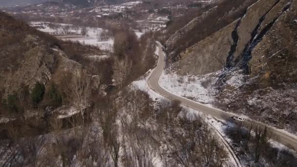 Car Drive Snow Winter Day Road Mountain Range Aerial View — стоковое видео