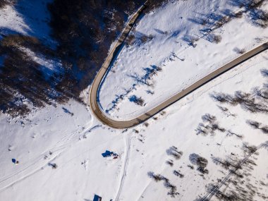 Stara Planina Babin Zub mountain in serbia covered with snow with road in winter day panorama tourist destination and ski center in Serbia top view on the road