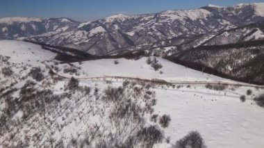 Old Mountain Balkan Stara Planina Babin Zub tourist resort in winter day covered with snow empty road