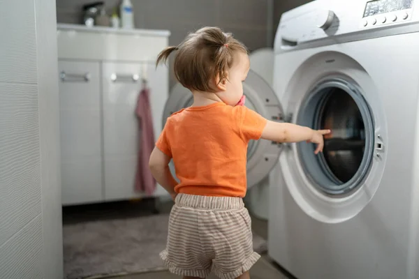 One Girl Small Caucasian Toddler Child Daughter Standing Washing Machine Royaltyfria Stockbilder