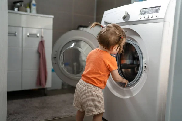 One Girl Small Caucasian Toddler Child Daughter Standing Washing Machine Stockbild