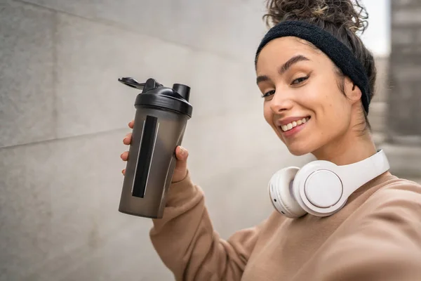 One Young Woman Headphones Prepare Training Hold Supplement Shaker Bottle — Stock Photo, Image