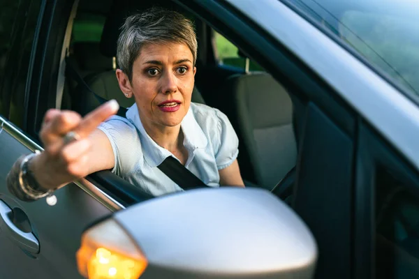 One Woman Senior Mature Female Driver Showing Middle Finger Trough — Stock fotografie
