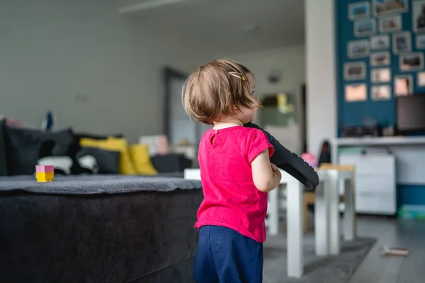 One Caucasian Toddler Girl Child Playing Slippers Home Room Alone — Foto Stock